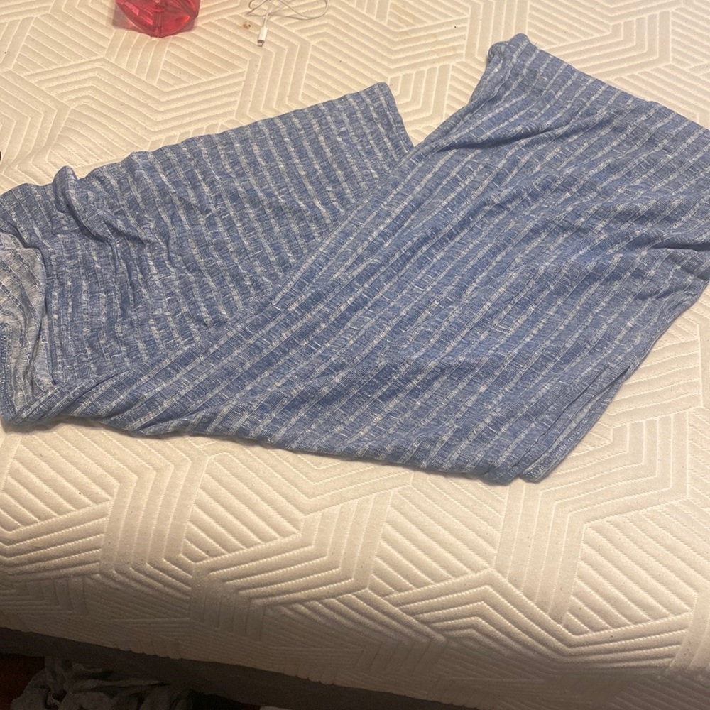 Long skirt with slit on each side.